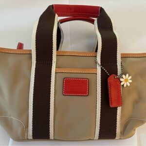 Small Tan/orange very gently used small Coach bag.